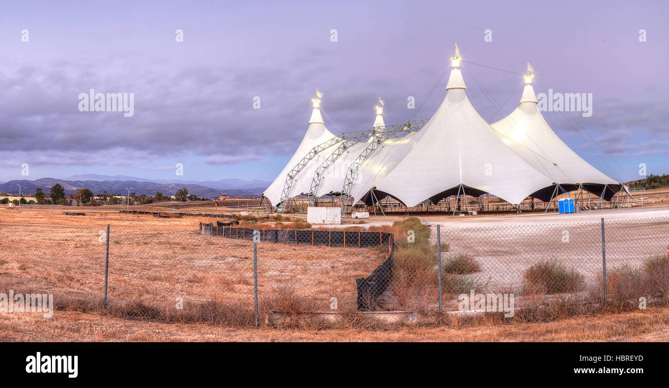 Sunset over a large circus tent Stock Photo - Alamy