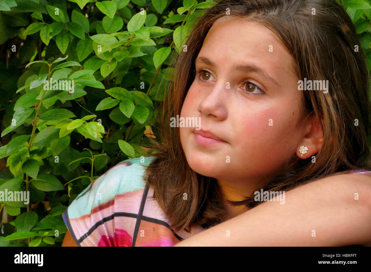 Little girl in the garden Stock Photo - Alamy