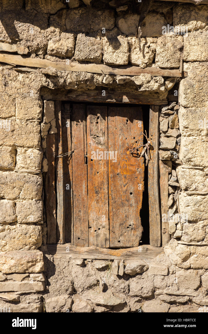 wooden door in a stone wall Stock Photo - Alamy