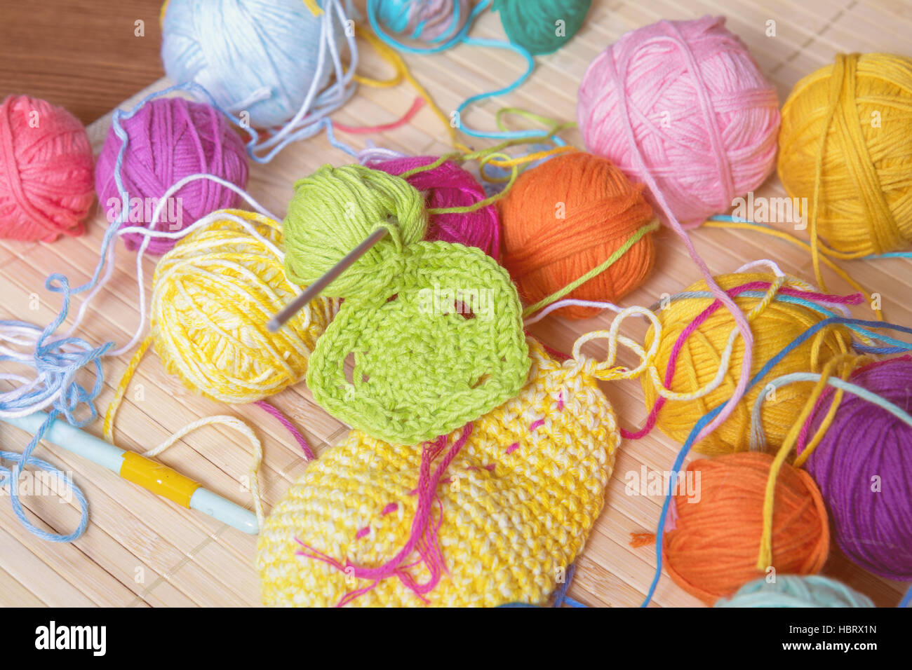 Colorful clews yarn and crochet hook Stock Photo Alamy