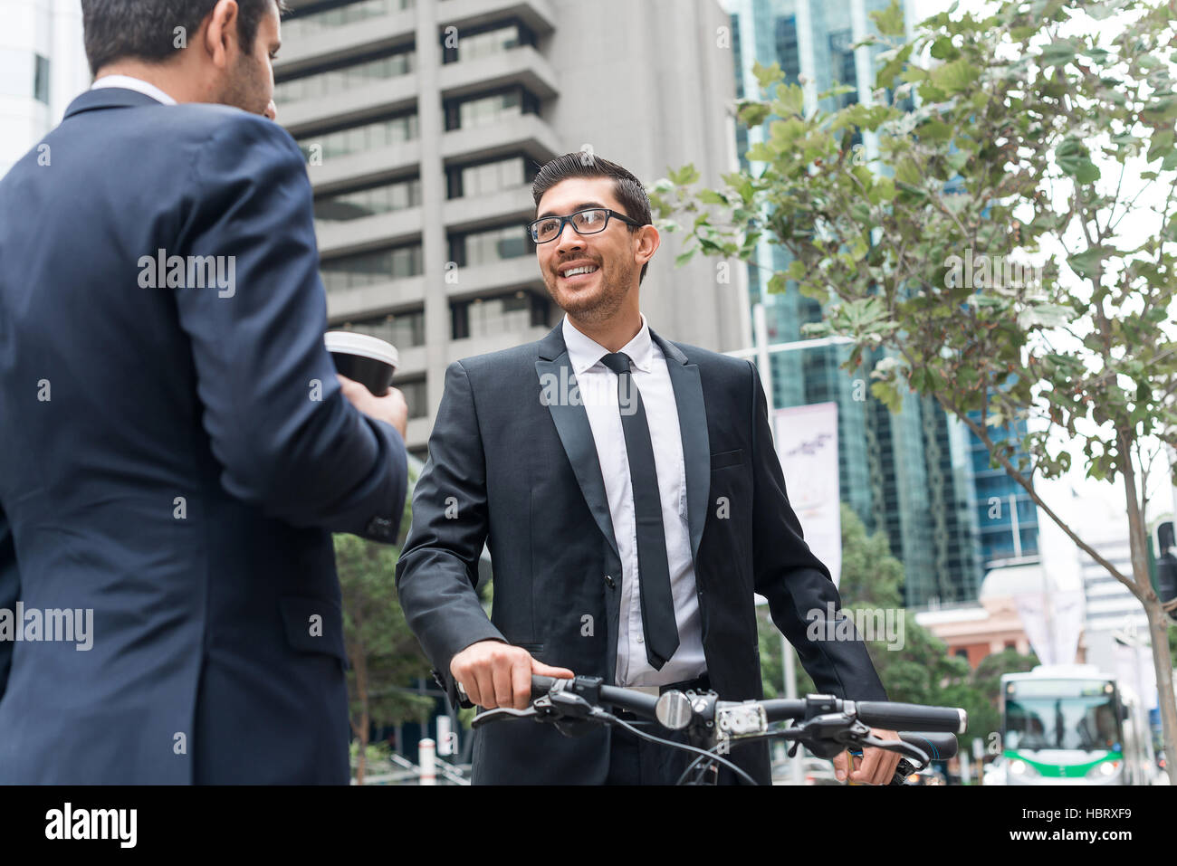 Two businessmen having walk Stock Photo - Alamy