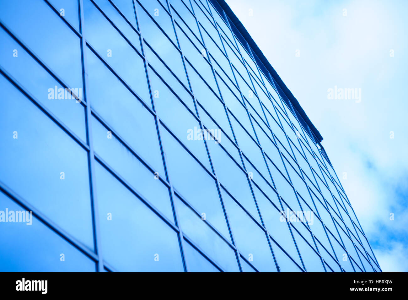 glass office building on a background of the sky Stock Photo