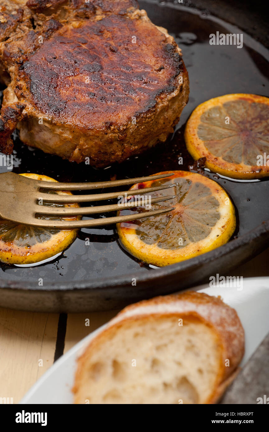 pork chop seared on iron skillet Stock Photo Alamy