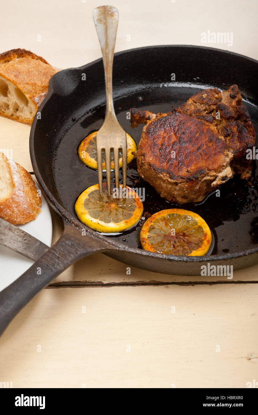 pork chop seared on iron skillet Stock Photo Alamy