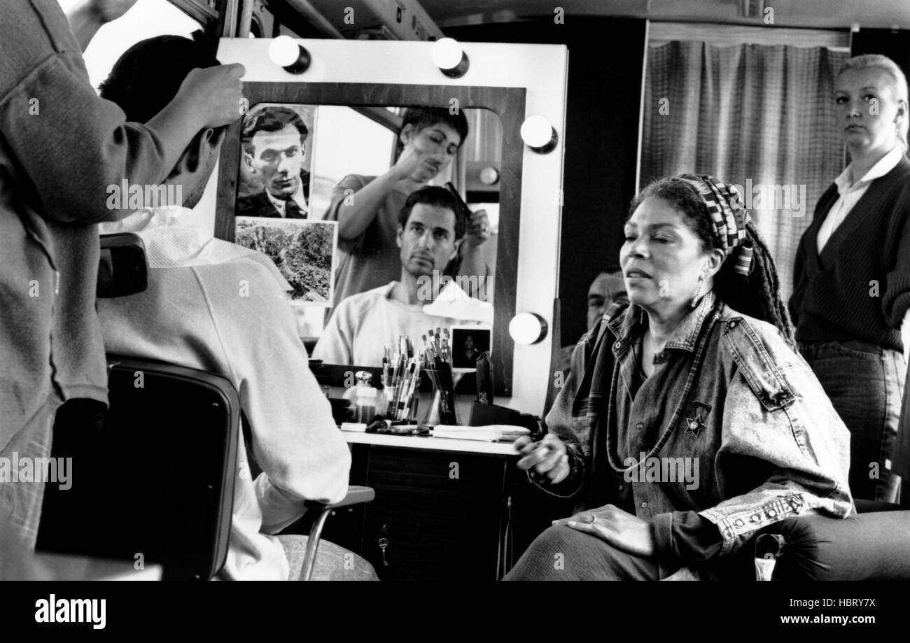 FORCED MARCH, seated from left Chris Sarandon, Rosalind Cash, 1989, © Shapiro Glickenhaus