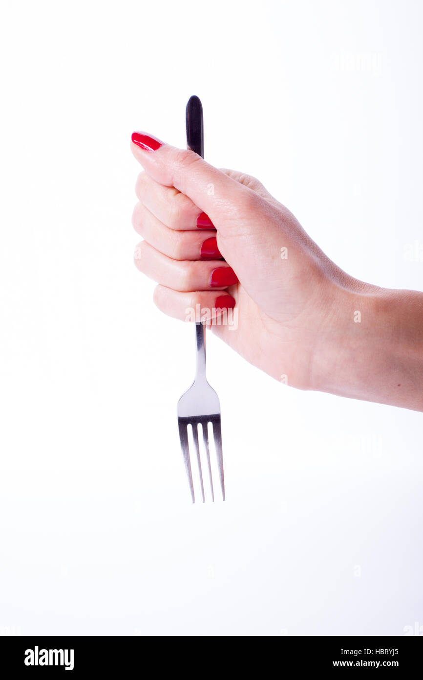 Woman hand holding fork Stock Photo