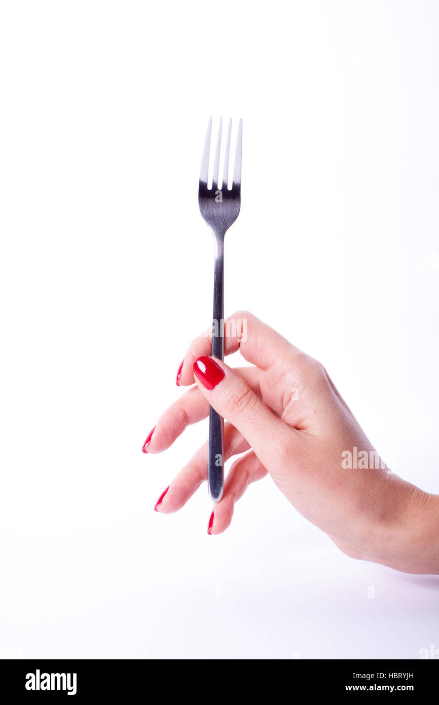 Woman hand holding fork Stock Photo