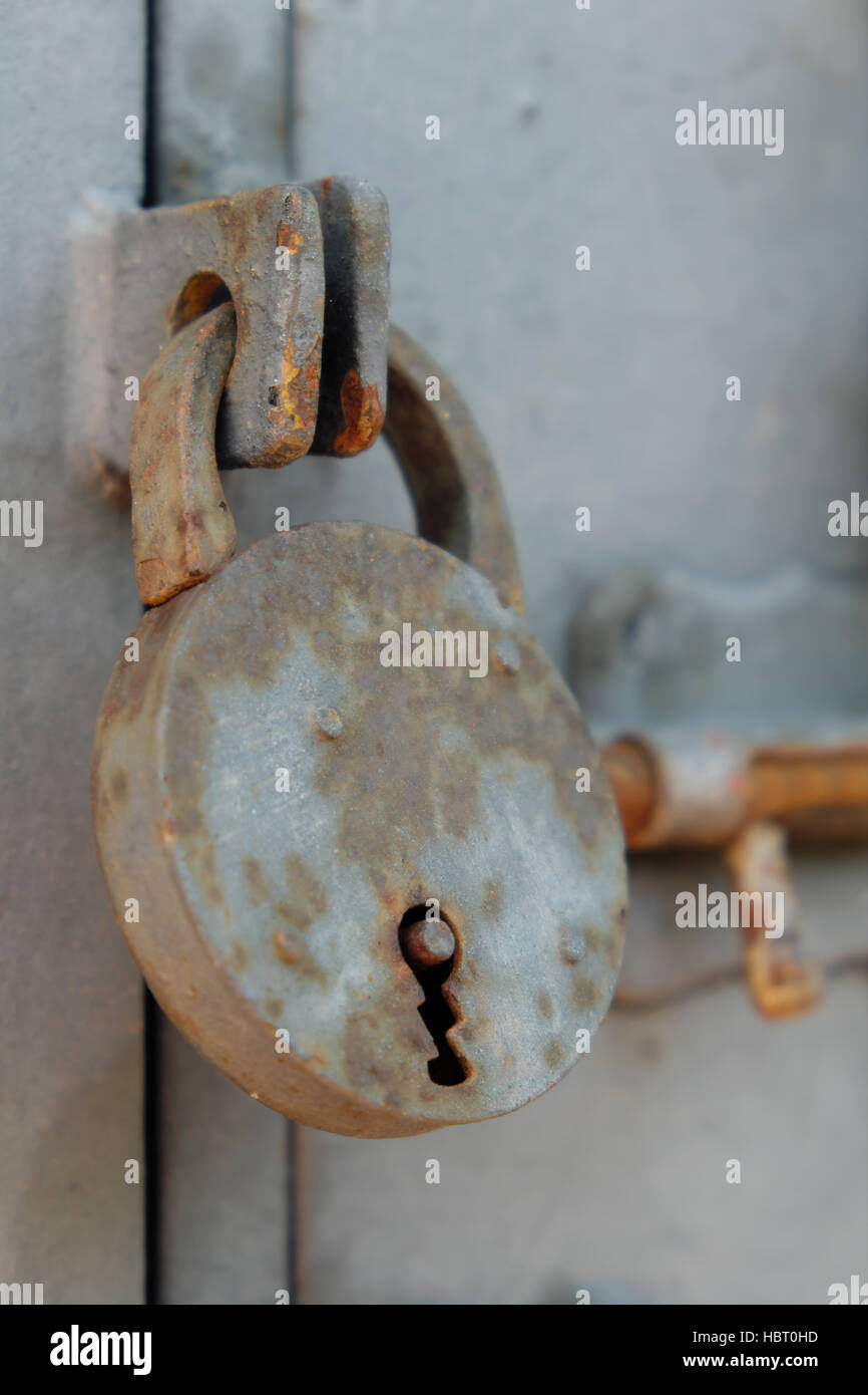 old vintage lock / padlock, closed  door Stock Photo