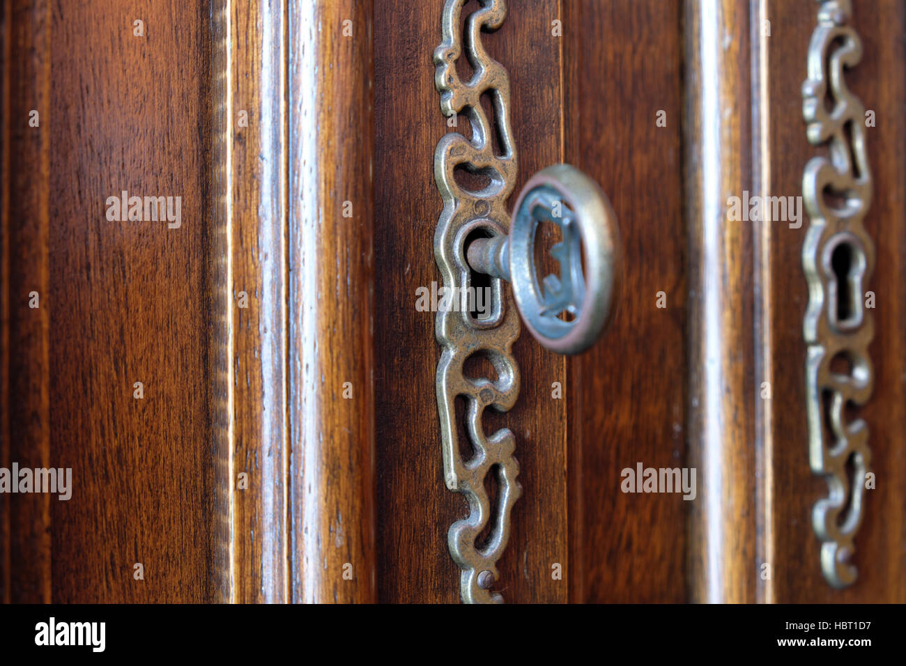 vintage key in beautiful wooden door / furniture Stock Photo Alamy