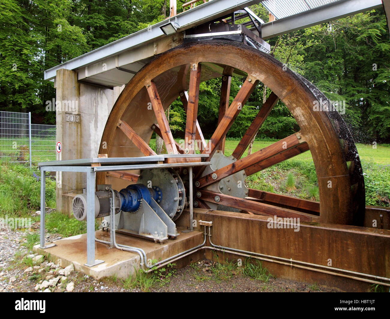 Modern water wheel to generate electricity Stock Photo - Alamy