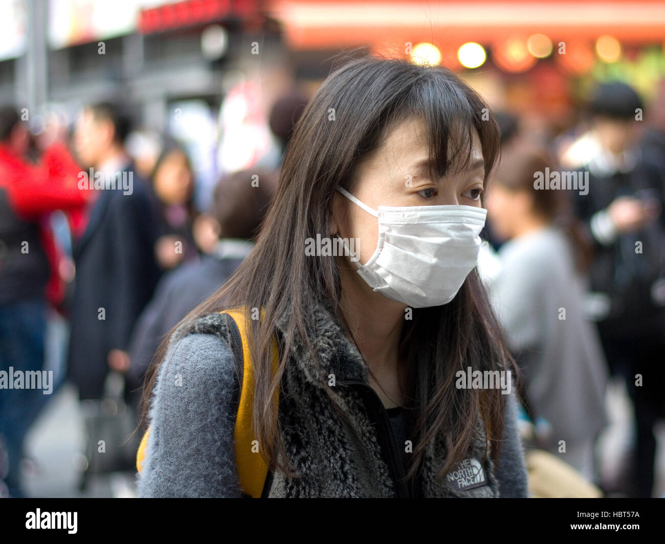 Japanese women wearing a surgical face mask. Stock Photo