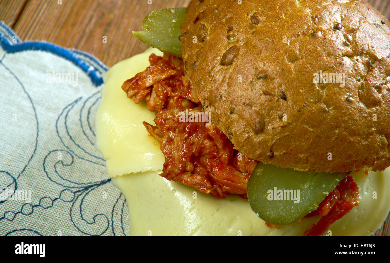 Tavern sandwich -  sandwich originally consisting of unseasoned ground beef on a bun, mixed with sauteed onions, and sometimes topped with pickles. Stock Photo