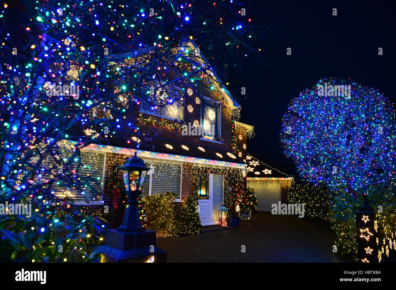 People admire Christmas lights on houses on Trinity Close in Burnhamon