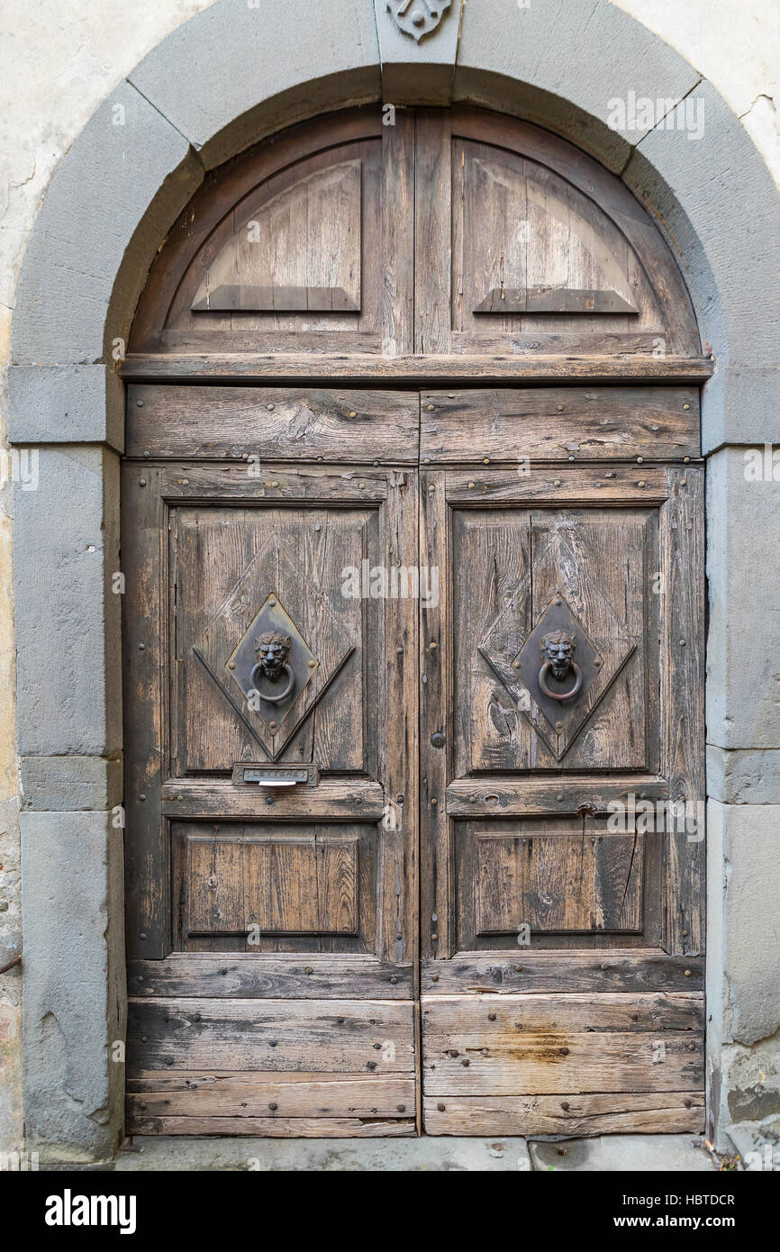 Wooden front doors of Barga. The medieval hilltop town of Barga, in Tuscany, Italy. Stock Photo