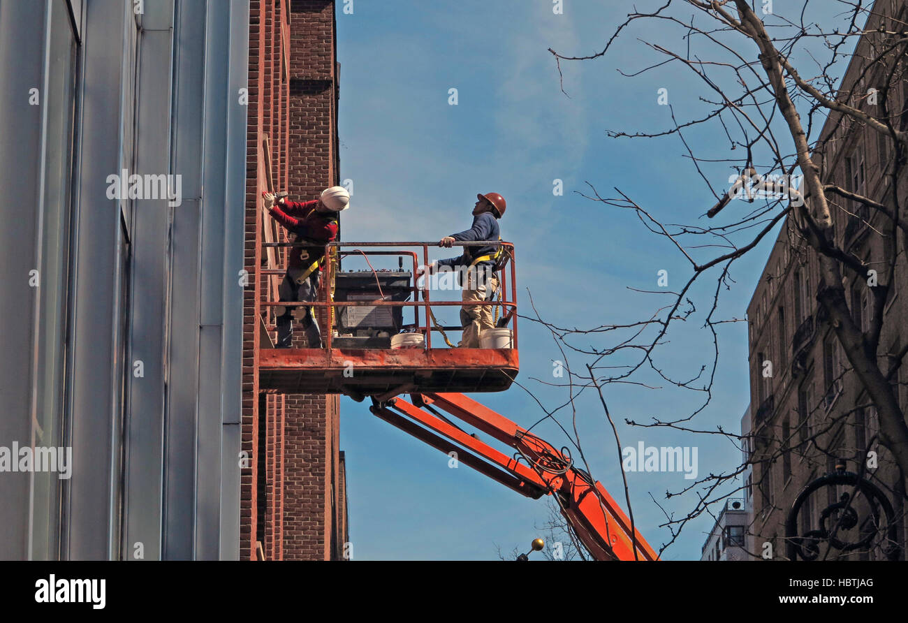 Men on a Crane Stock Photo - Alamy