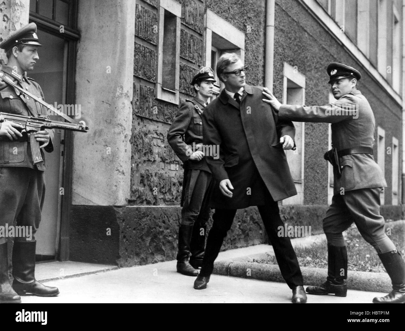 FUNERAL IN BERLIN, Michael Caine (ctr.), 1966 Stock Photo Alamy