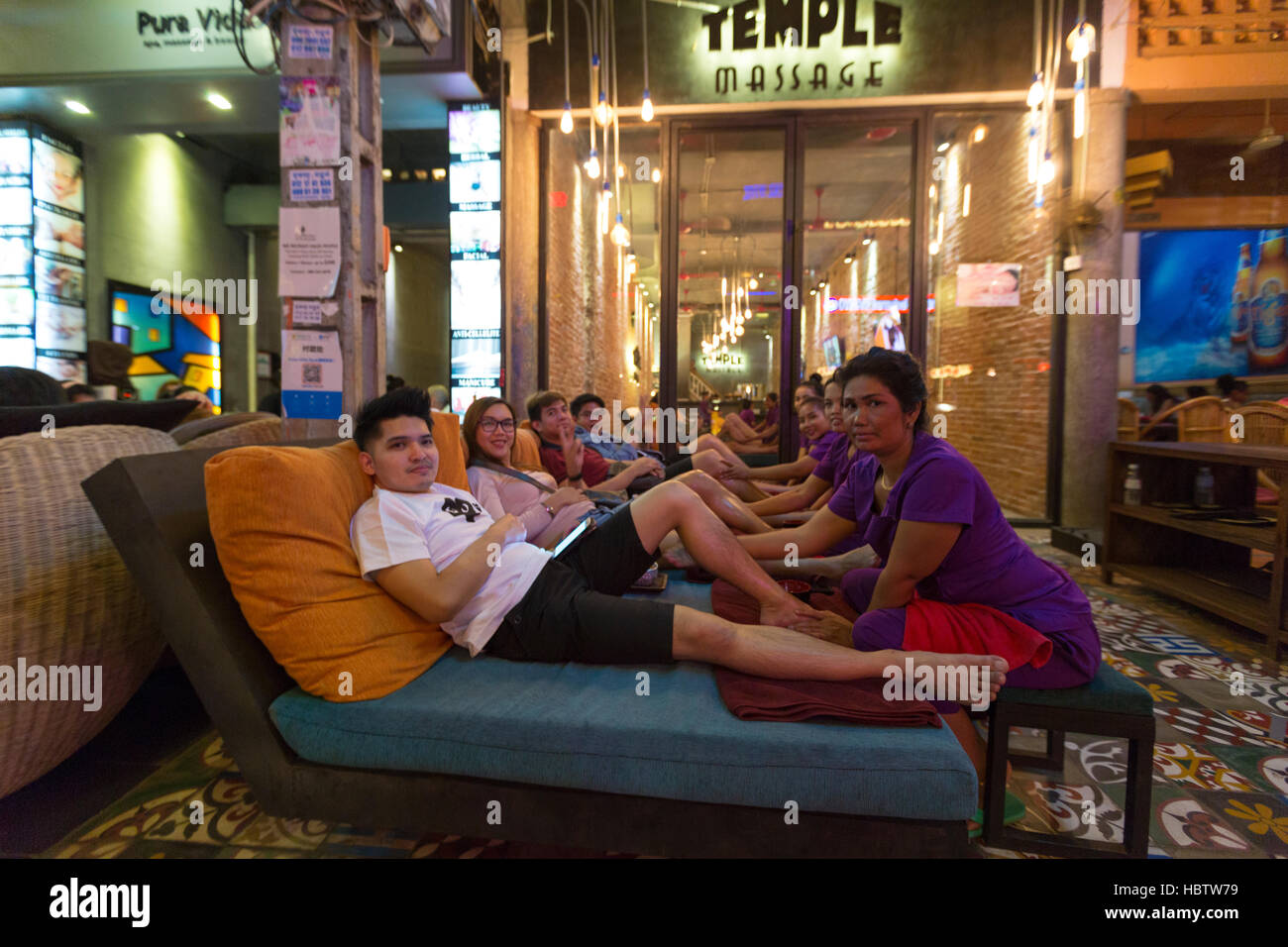 People having outdoor massage in Siem Reap at night. Cambodia Stock Photo