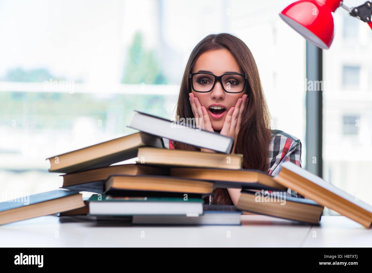 The Young Woman Student With Many Books Stock Photo - Alamy