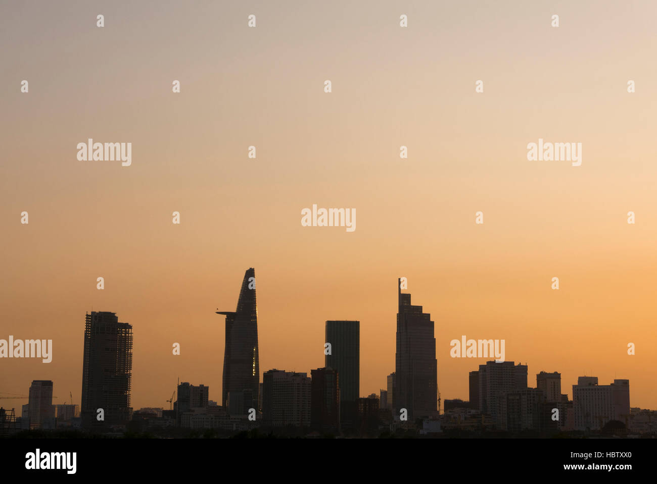 Sunset in Saigon with Bitexco tower silhouette, Vietnam Stock Photo