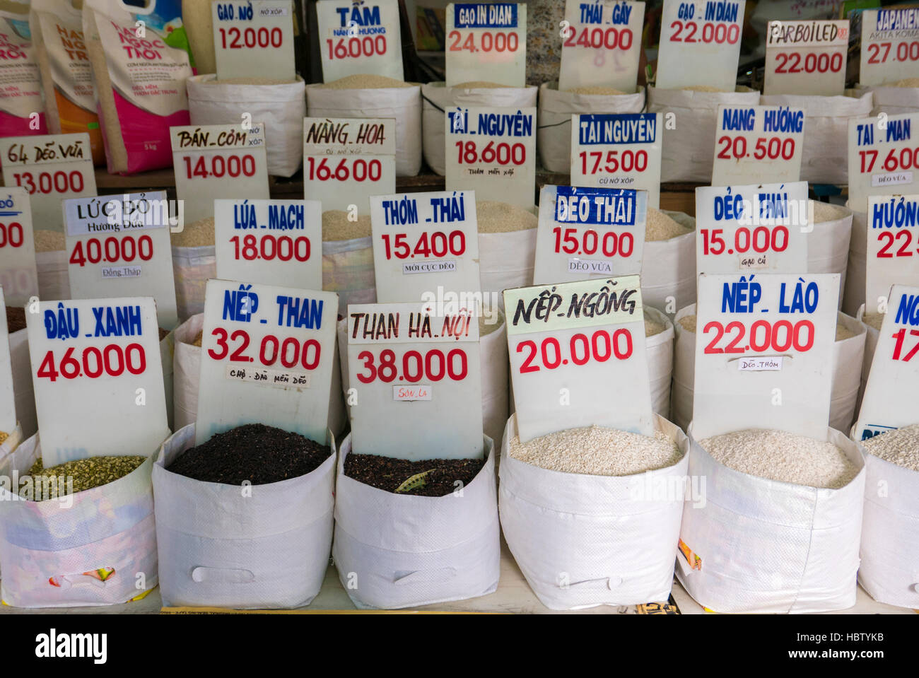 Close up of bags of rice in a local market in Vietnam with price Stock