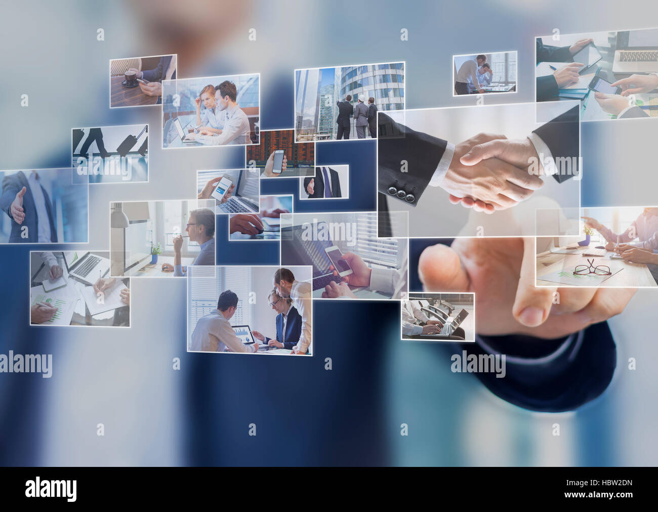 Businessman touching a photo on a digital screen interface, abstract images of business situations Stock Photo