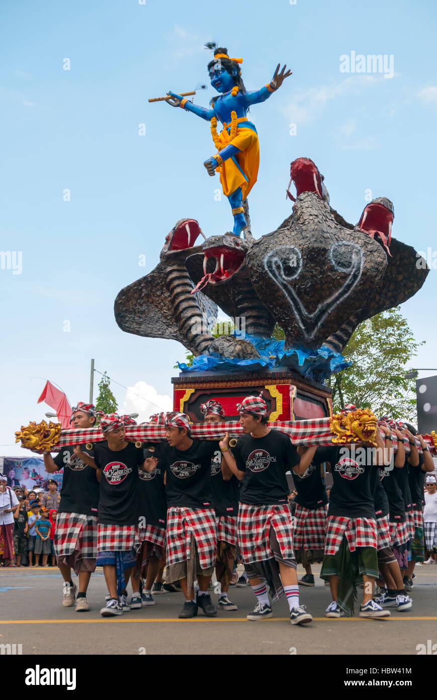 Group of men holding traditional sculpture. Nyepi ceremony in Bali ...