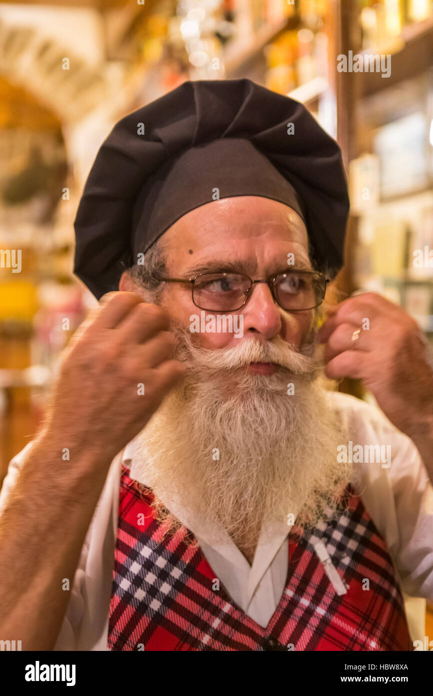 The owner of Da Aristo Di Togneri Lorenzo bar and restaurant in Piazza Salvi. Proud to be twinned with Scotland. Barga, in Tuscany, Italy. Stock Photo