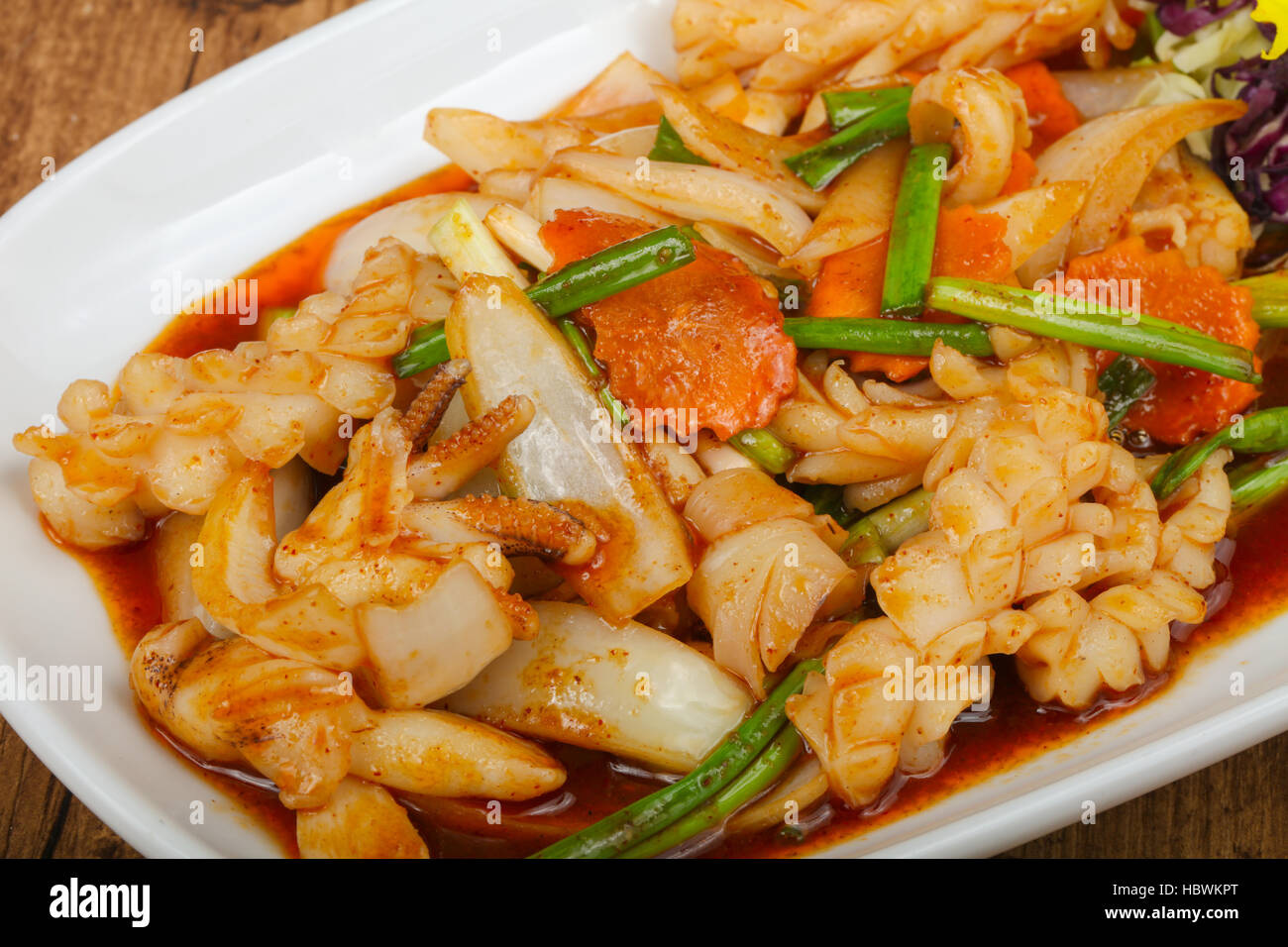 Squid in sauce with spices - Asian cuisine Stock Photo - Alamy