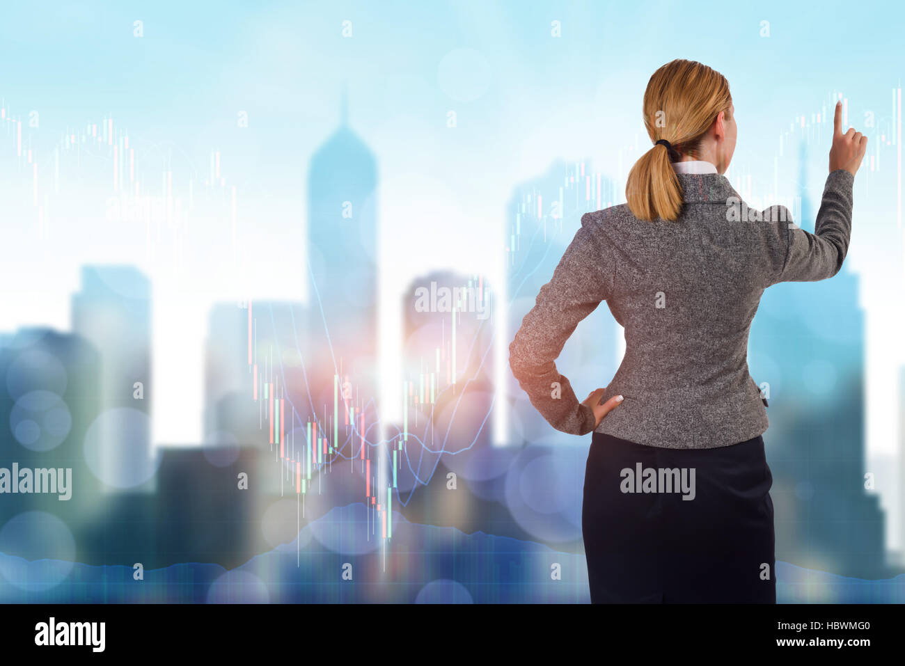 Businesswoman pressing buttons on line chart Stock Photo - Alamy