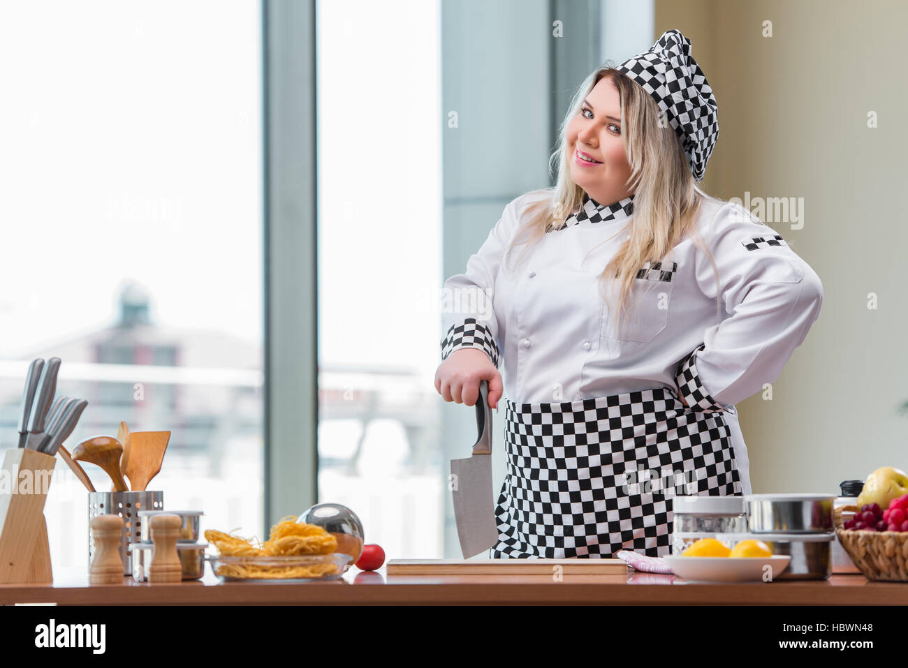 Young chef cook working in the kitchen Stock Photo Alamy
