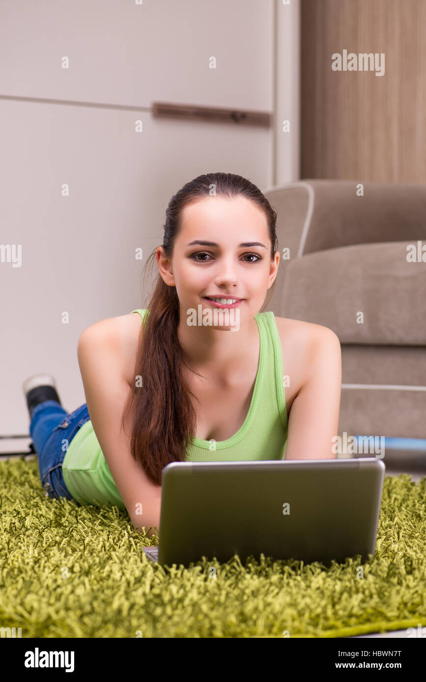 Young woman working at laptop at home Stock Photo - Alamy