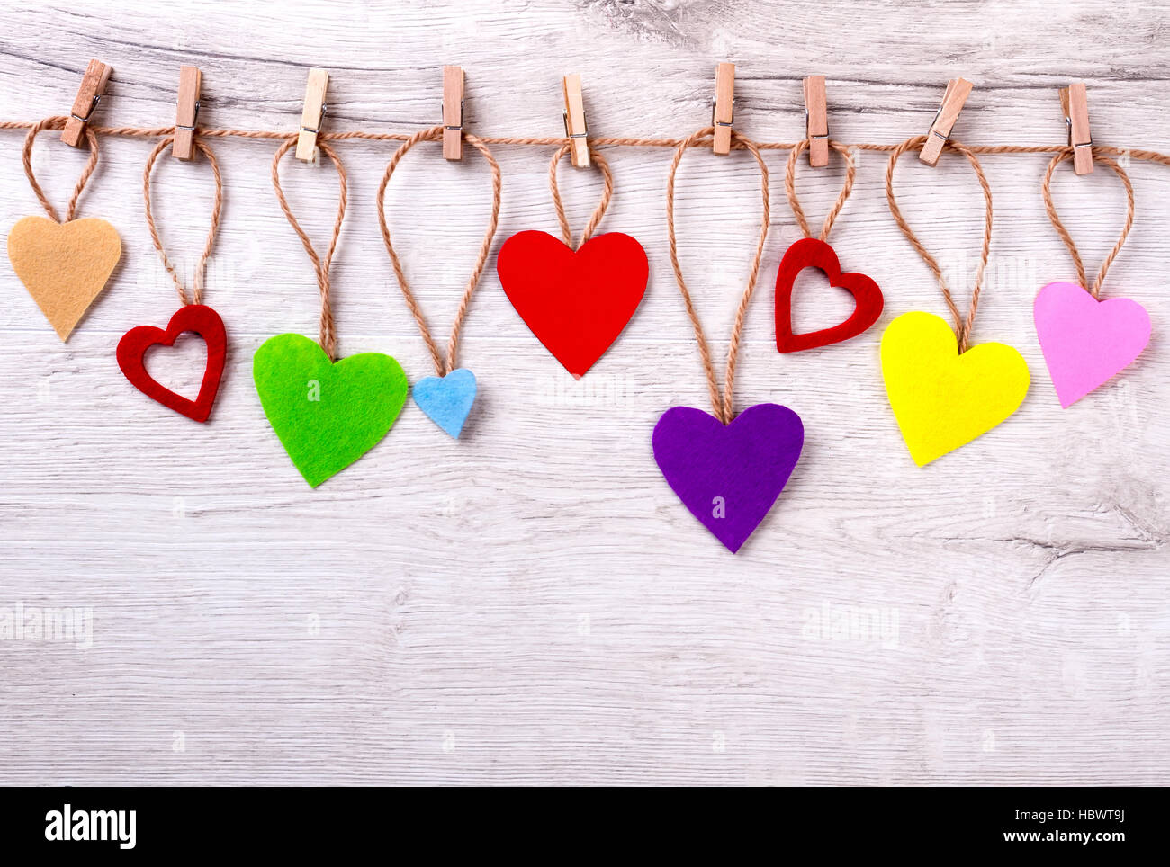Many colorful hearts on rope. Stock Photo