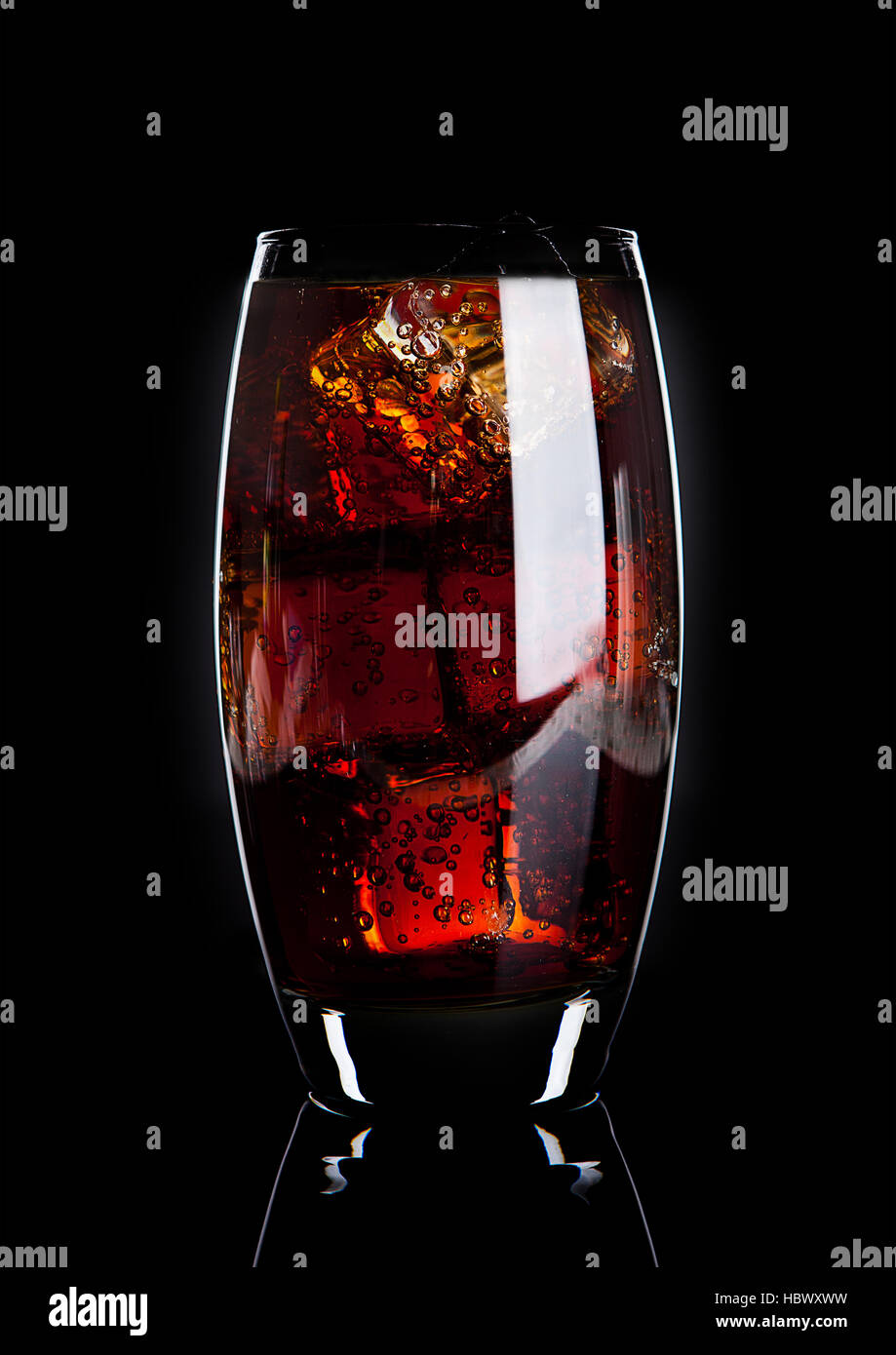 Glass of cold cola soda drink with ice cubes on black background Stock ...
