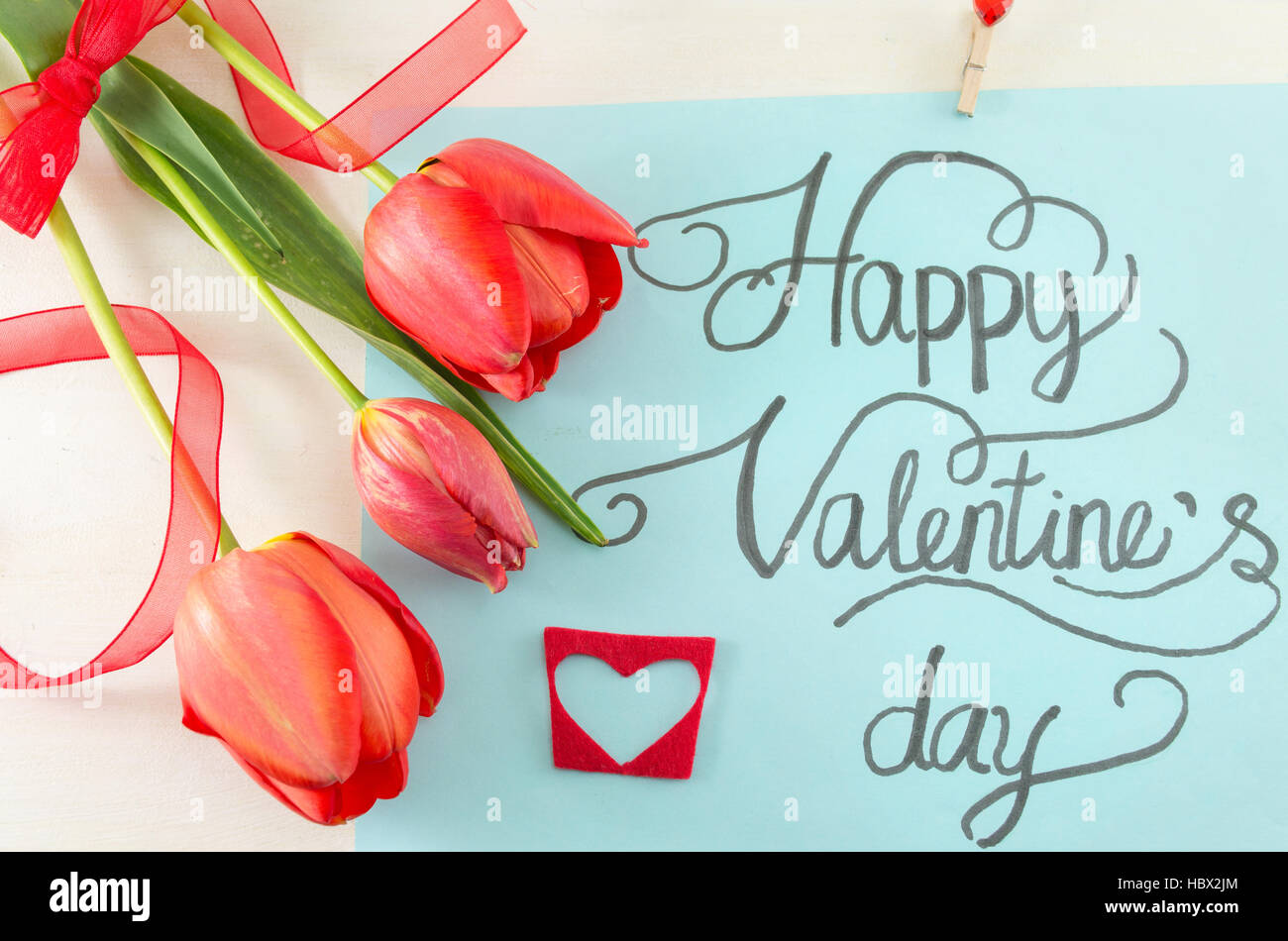 Happy Valentines day card calligraphy with tulips Stock Photo