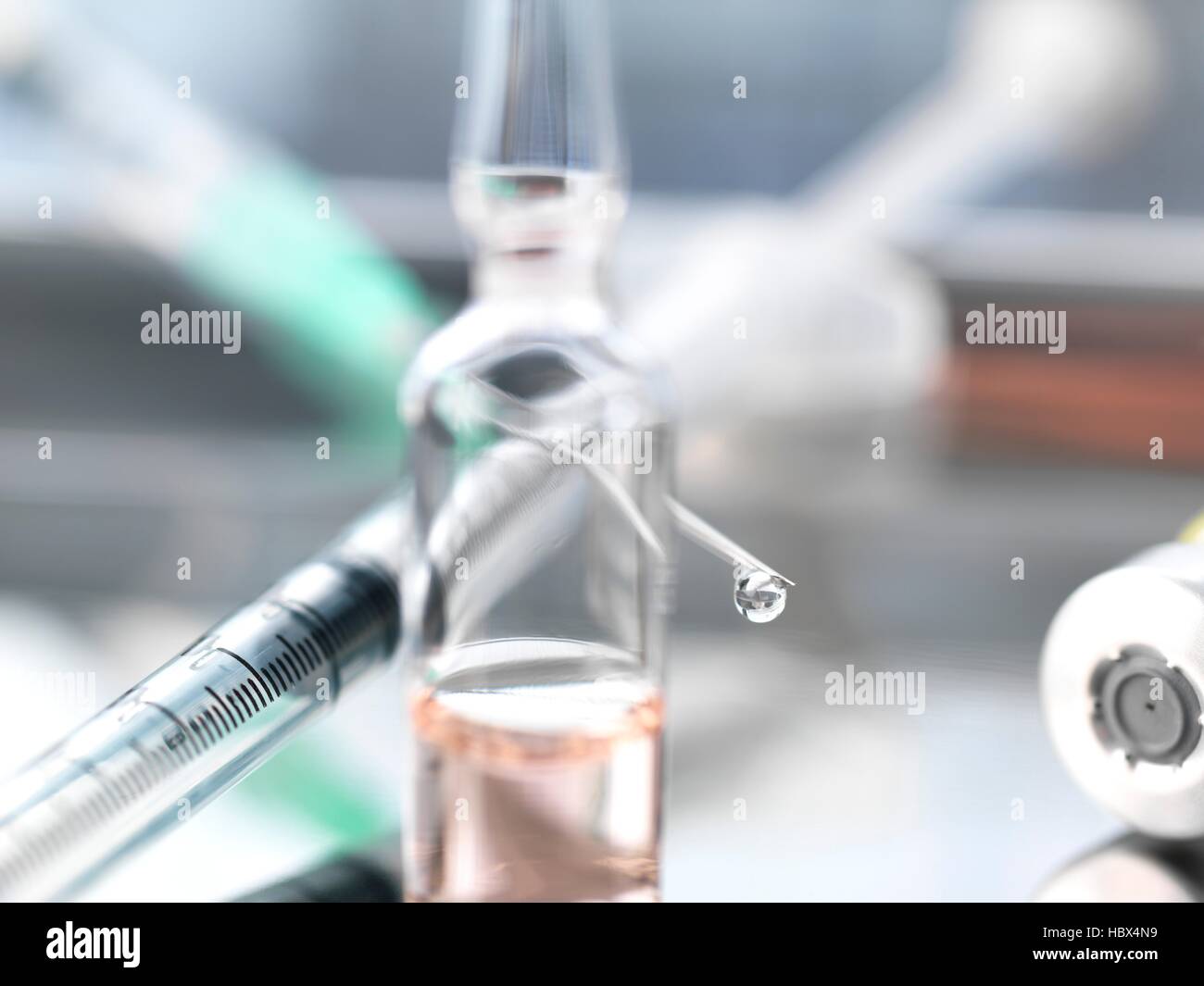 Drug ampule and syringe. Stock Photo