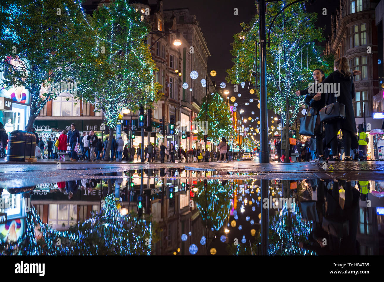 LONDON NOVEMBER 16, 2016 Holiday lights twinkle in a puddle