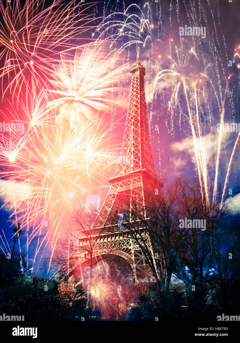 abstract background of Eiffel tower with fireworks, Paris, France - New Year Stock Photo