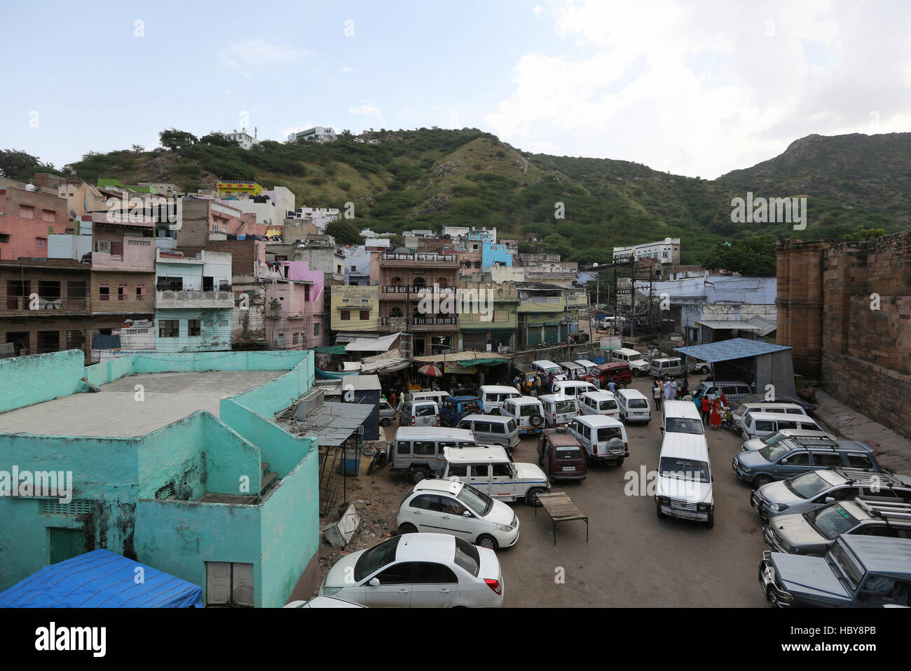 View of car parking area and city houses from Adhai Din Ka Jhonpra in Ajmer, Rajasthan, India Stock Photo