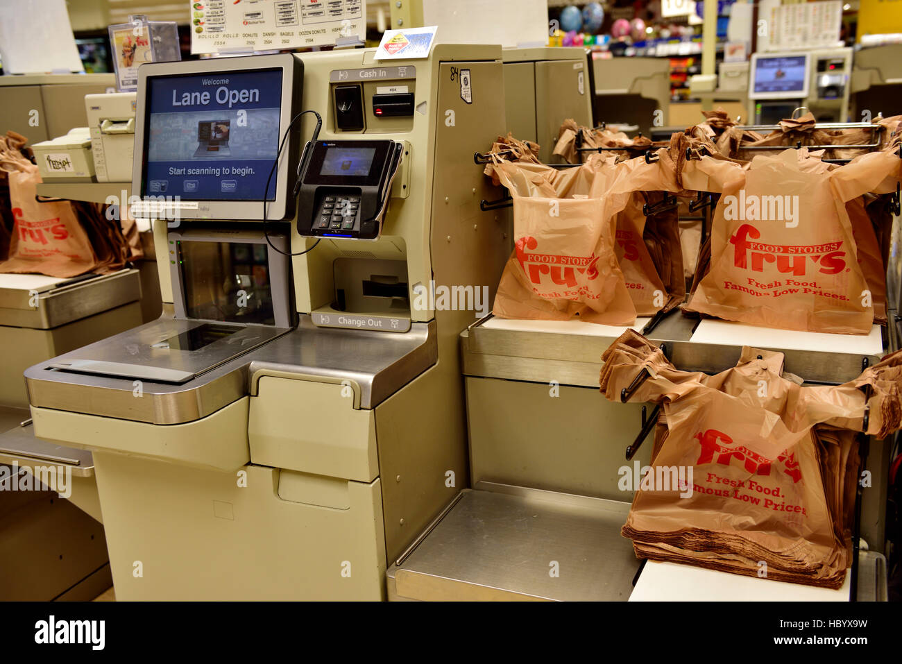 Self service check out till with plastic carrier bags in Fry's food stores Arizona, USA. Stock Photo