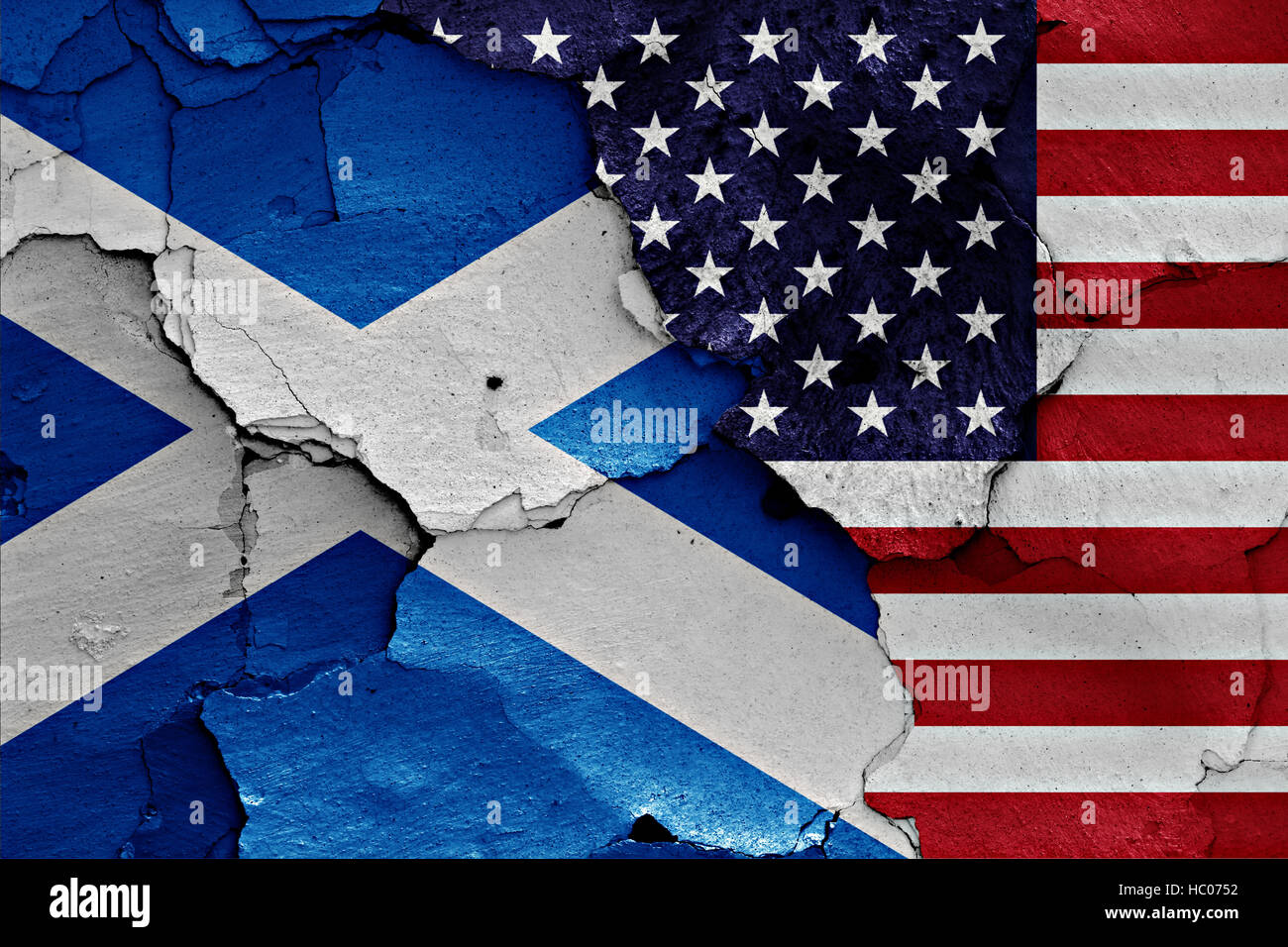 flags of Scotland and USA painted on cracked wall Stock Photo