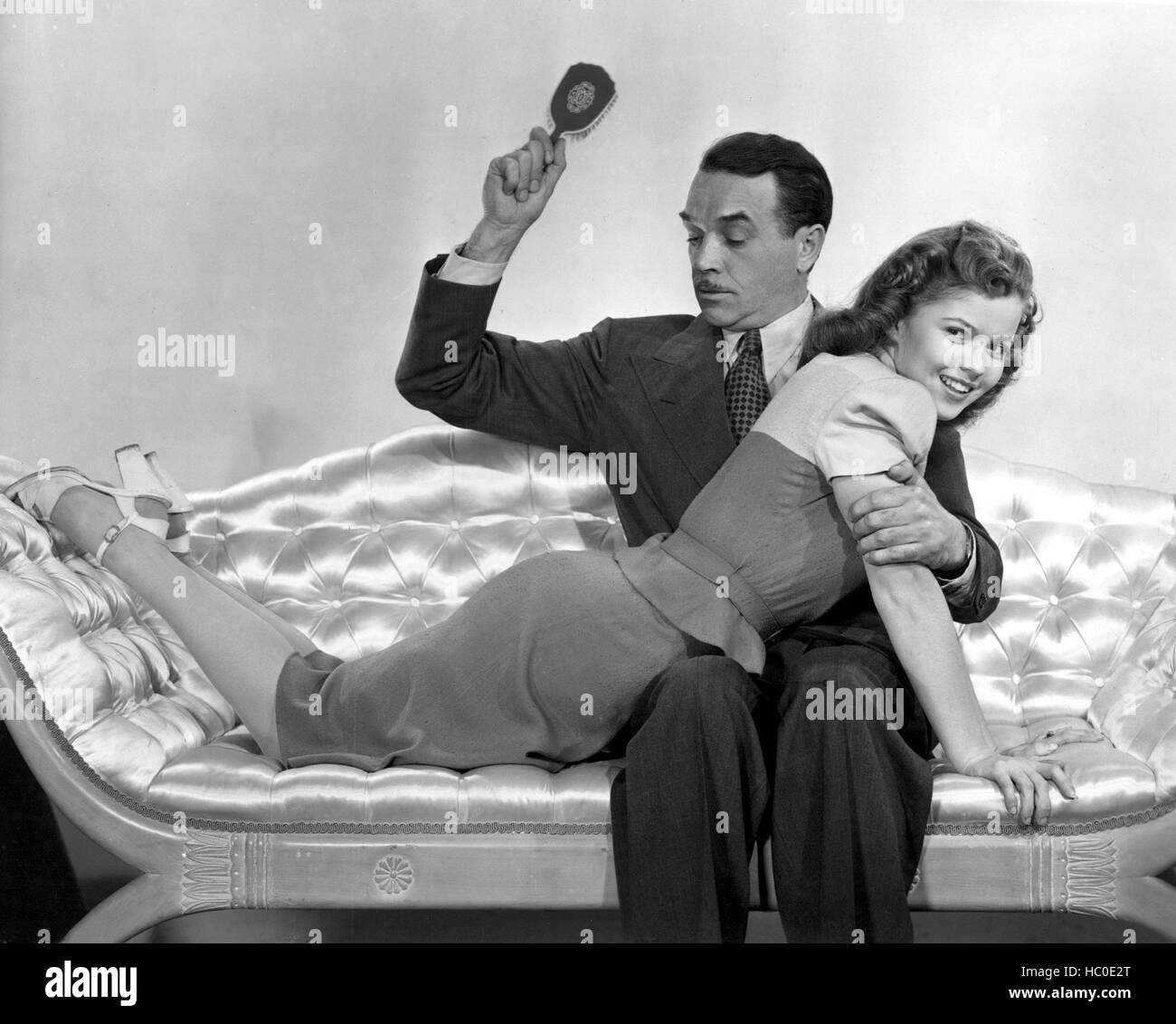 KISS AND TELL, Walter Abel, Shirley Temple, 1946, spanking his daughter  with a hairbrush Stock Photo - Alamy