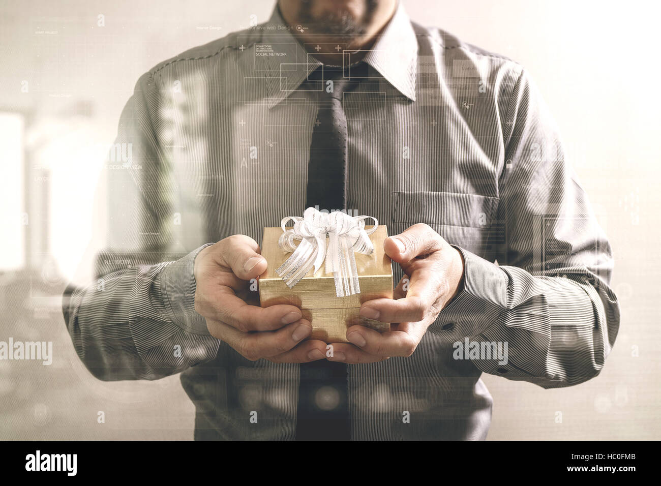 gift giving,businessman hand holding a gift box in a gesture of giving