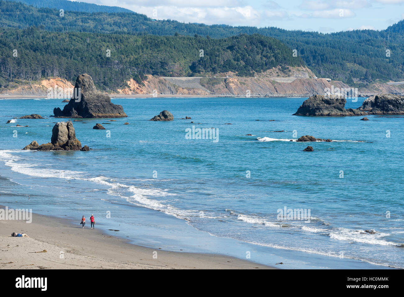 Couple walking on the beach in Port Orford, Oregon Stock Photo Alamy