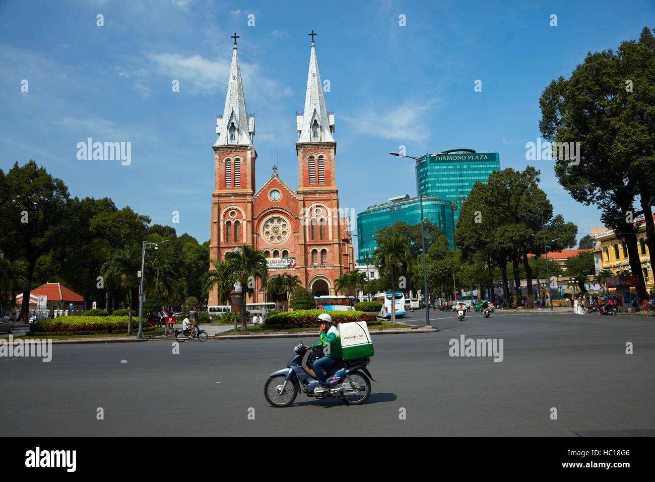 Motorcyclist and Notre-Dame Cathedral Basilica of Saigon, Ho Chi Minh City (Saigon), Vietnam Stock Photo