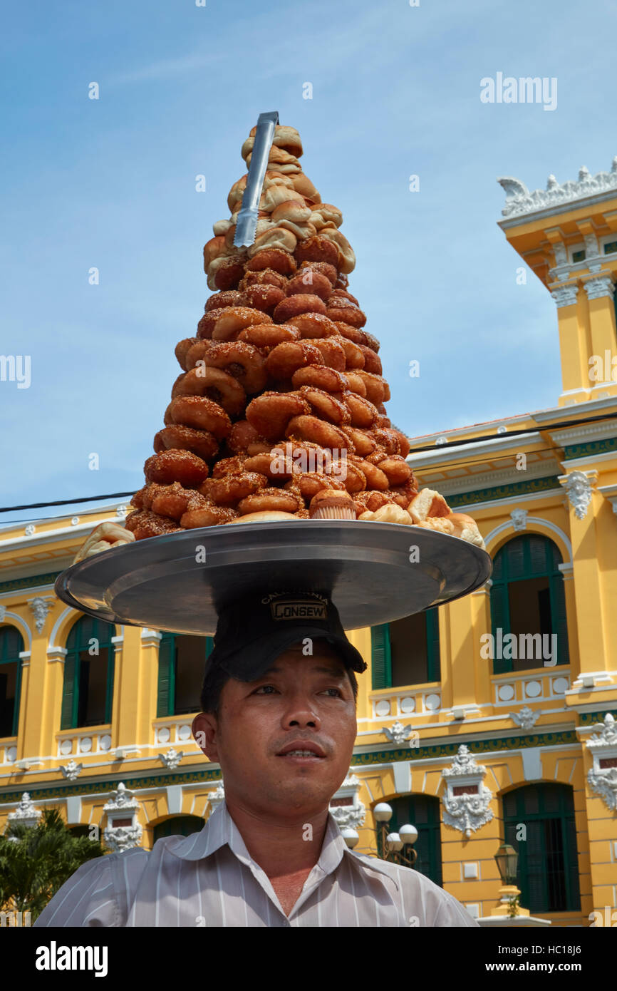 Man selling pastries, Historic Central Post Office, Ho Chi Minh City