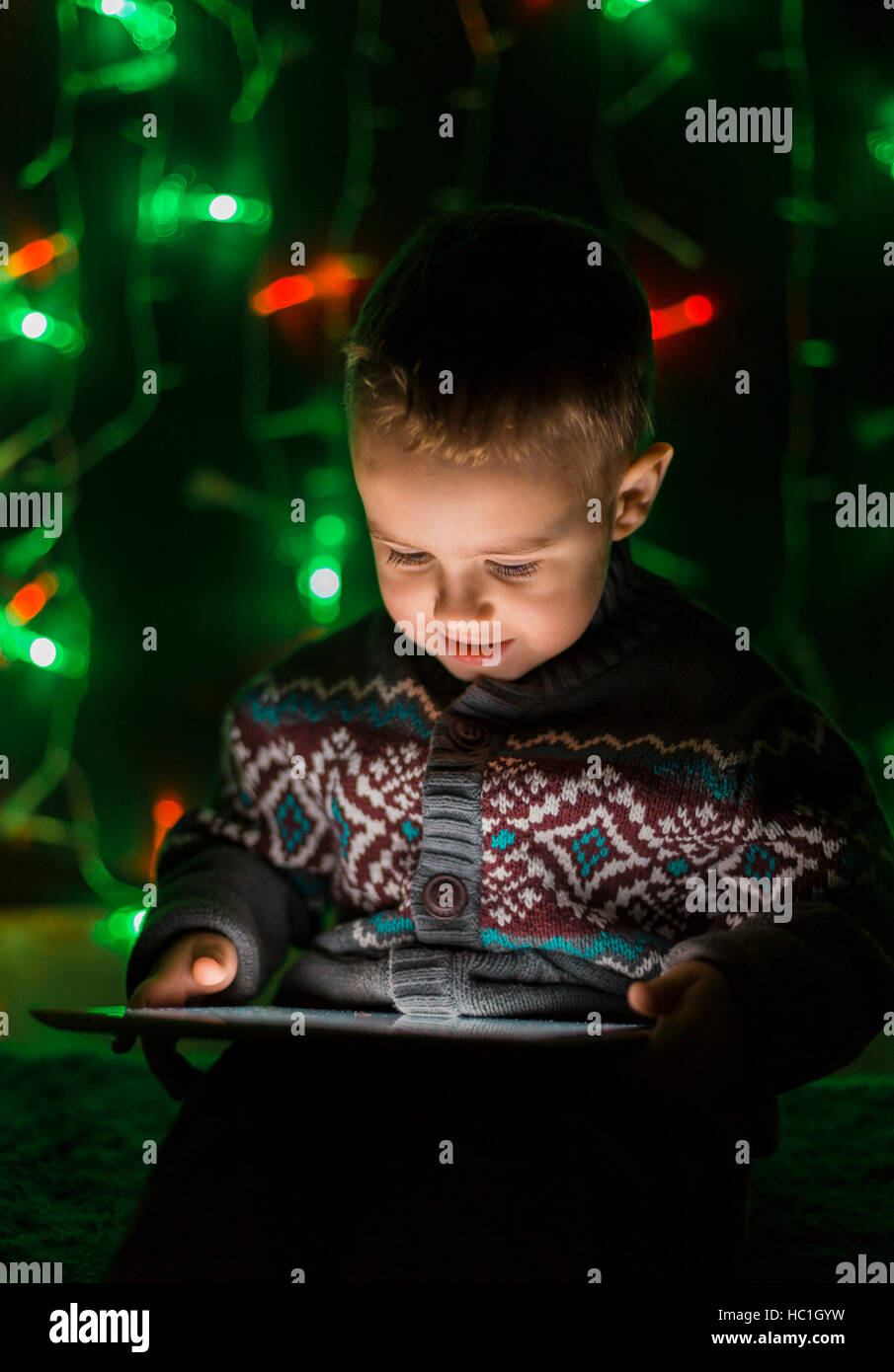 Little Boy Using Tablet PC Stock Photo - Alamy