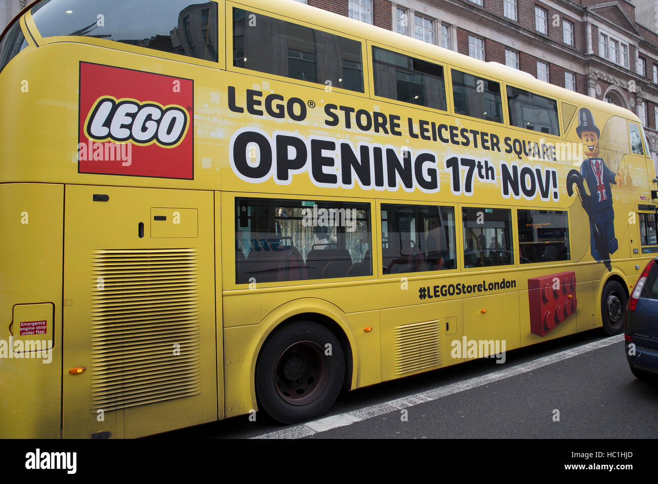 London bus is painted yellow to advertise the new Lego store opening in  Leicester Square Stock Photo - Alamy