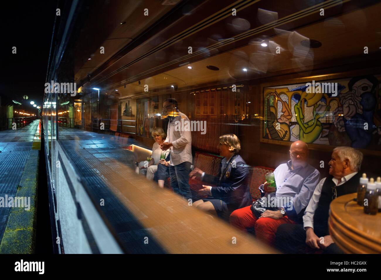 Inside of Transcantabrico Gran Lujo luxury train travellong across northern Spain, Europe. Interior of discotheque car. Gintonics tasting. Stock Photo