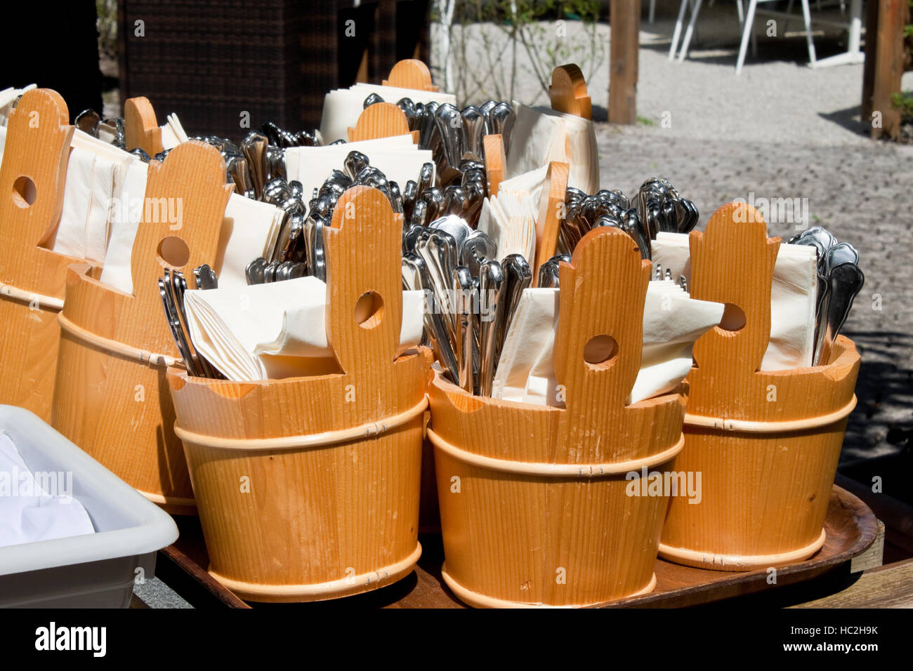 forks, spoons and knives prepared to be served in an outdoor cafe Stock