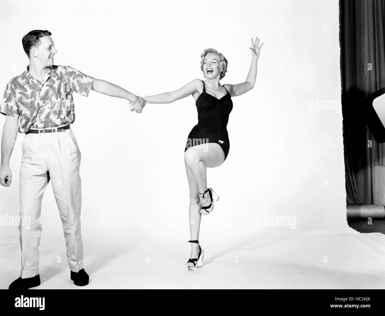 MONKEY BUSINESS, Marilyn Monroe, with an anonymous Fox employee, posing ...